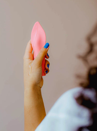 somebody holding the firefighter vibrator by smile makers