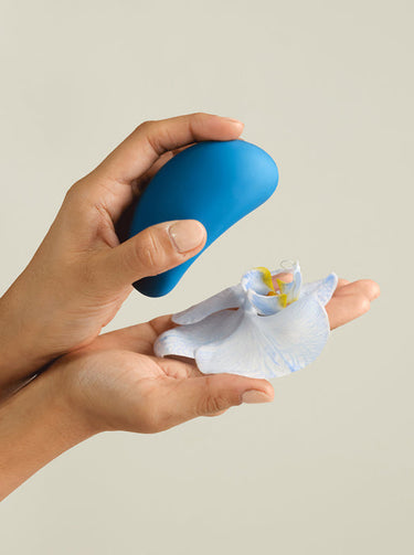 the ballerina and a blue flower