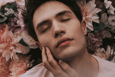 man in a bed of flowers