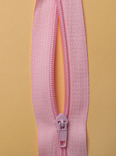 a pink zip that looks like a vulva