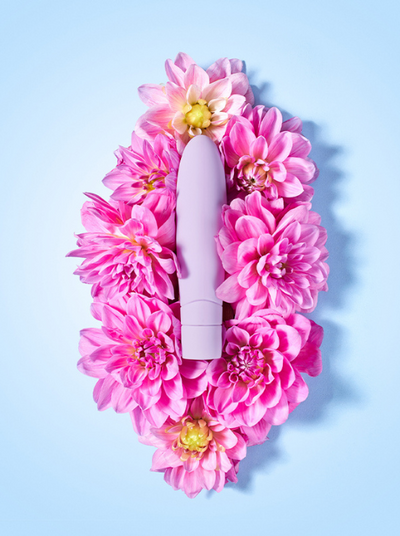 a vibrator on a vulva made of flowers