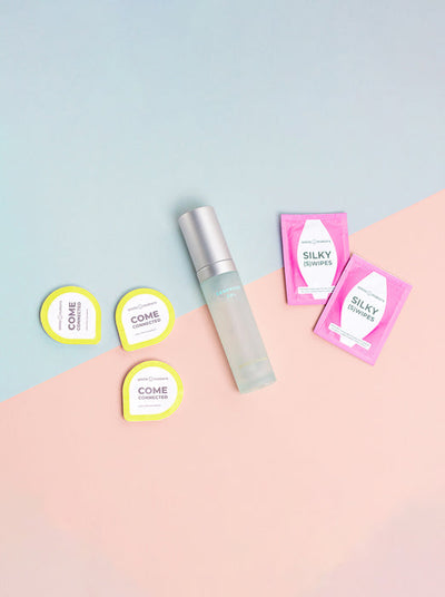 flatlay of condoms, lube and intimate wipes