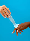 one hand stroking another with a tongue vibrator